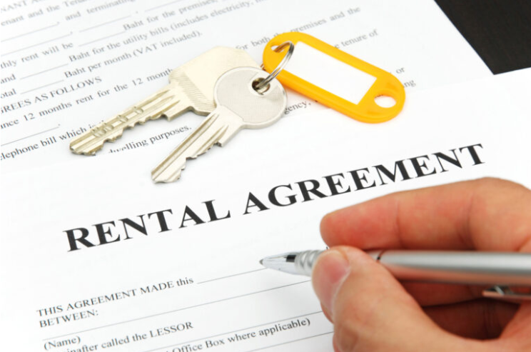 Rental agreement signing process showing lease documentation and tenancy contract execution